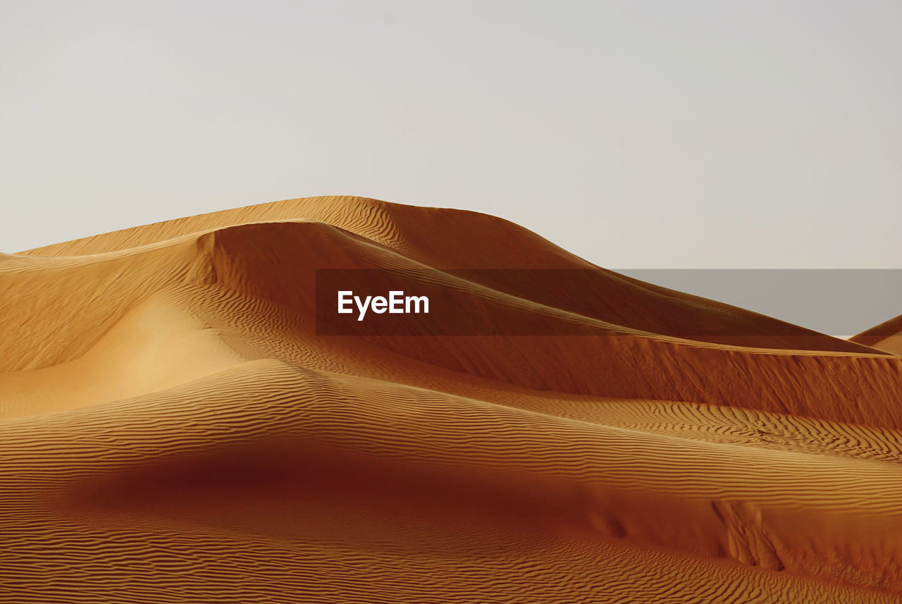 Scenic view of desert against clear sky