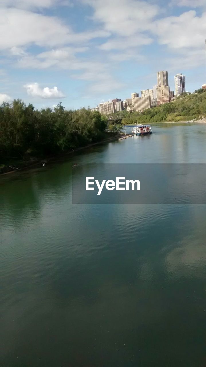 RIVER WITH CITY IN BACKGROUND