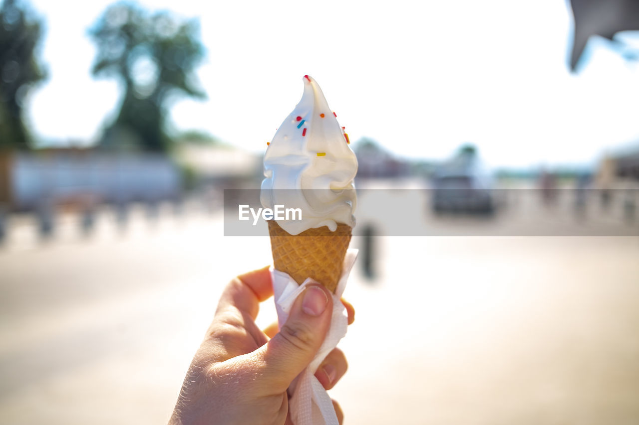 Hand holding ice cream cone