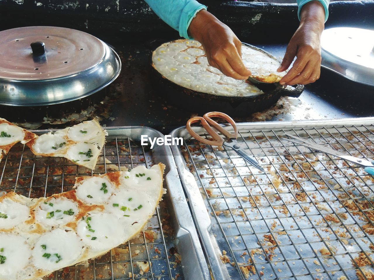 cropped hand of man preparing food
