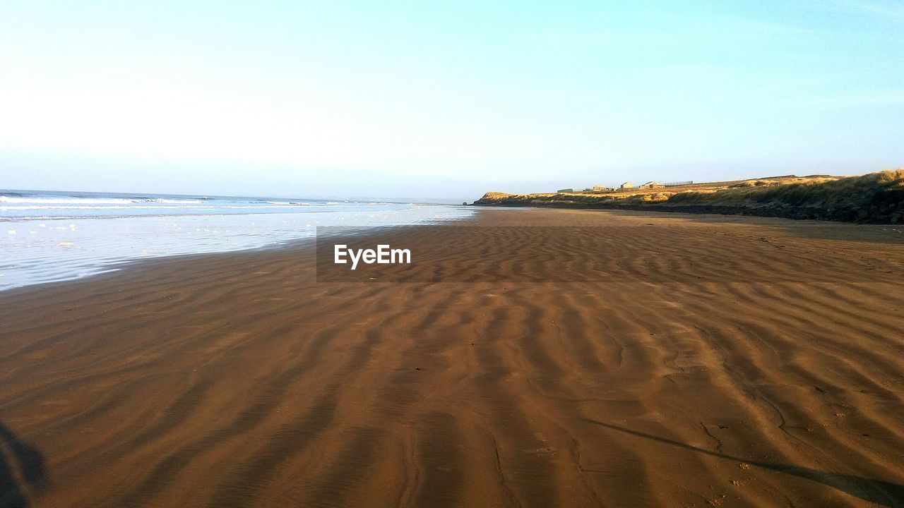 View of beach against clear sky