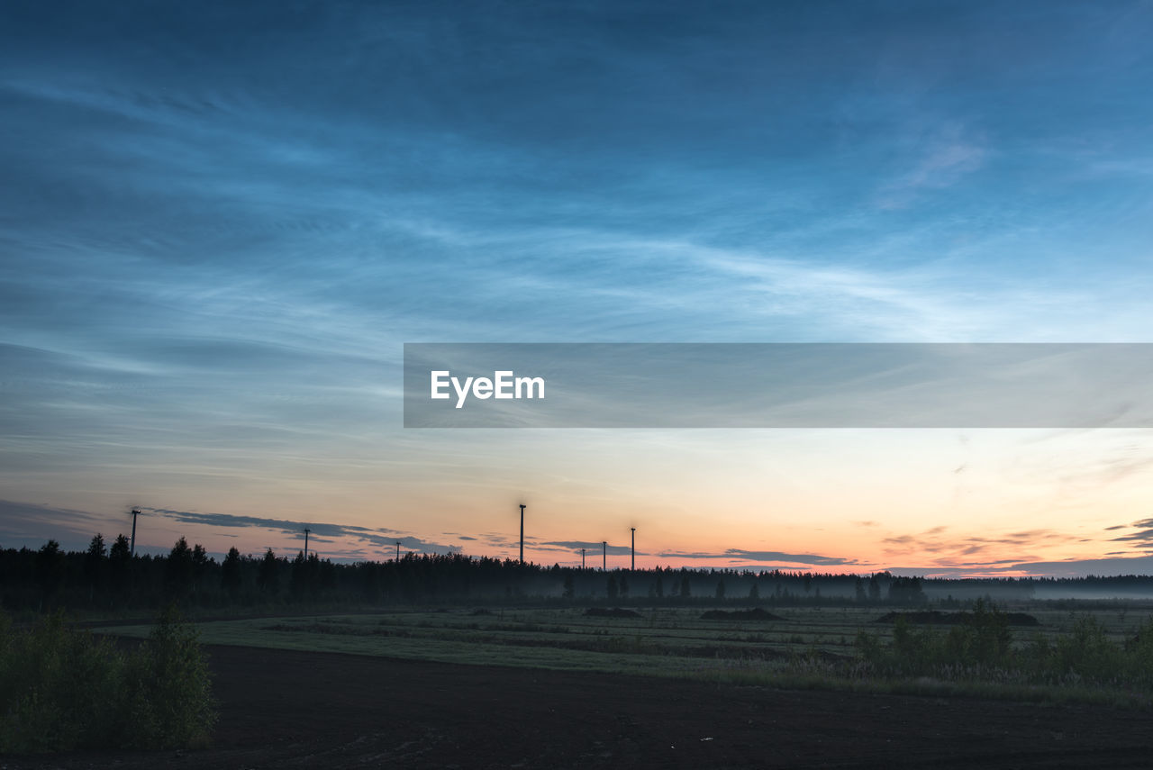 SILHOUETTE FIELD AGAINST SKY DURING SUNSET