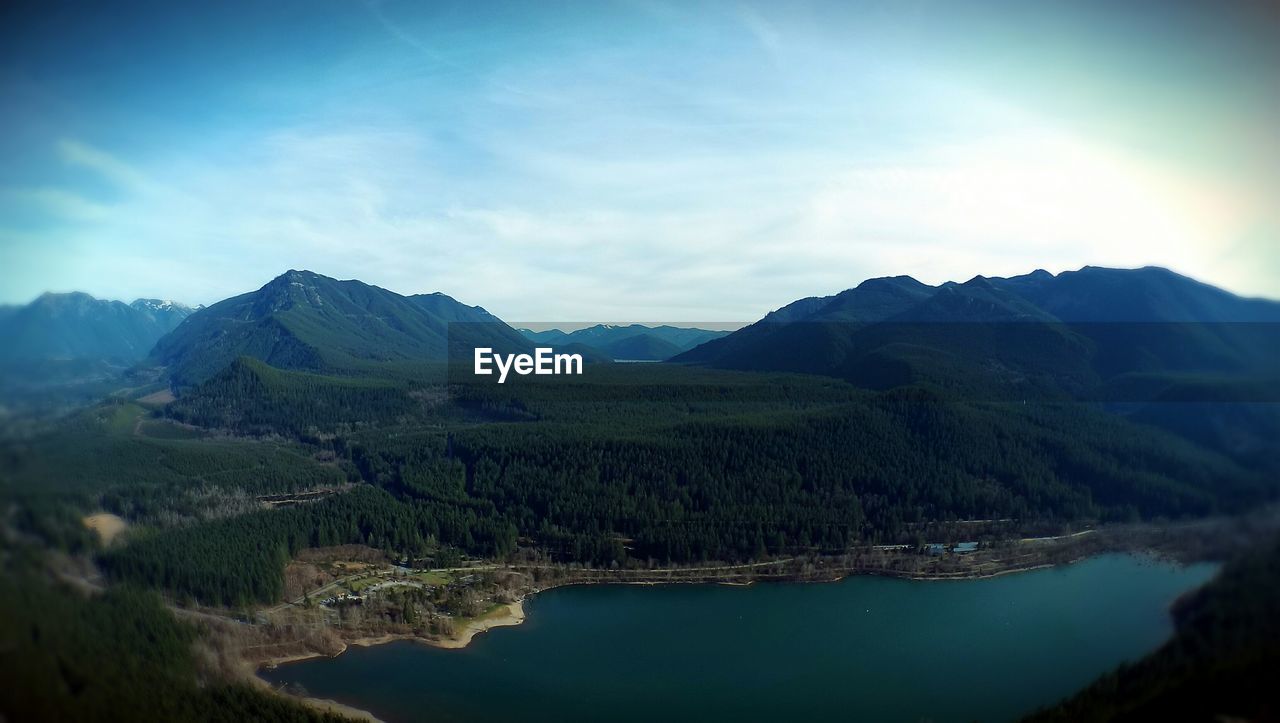 High angle view of calm lake surrounded by mountains