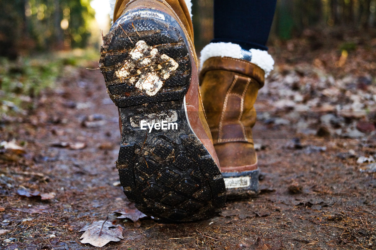 Low section of woman wearing boots