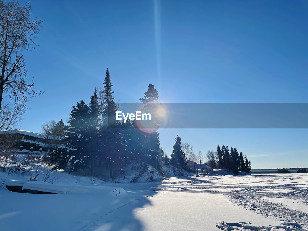 SCENIC VIEW OF SNOW COVERED LAND AGAINST SKY