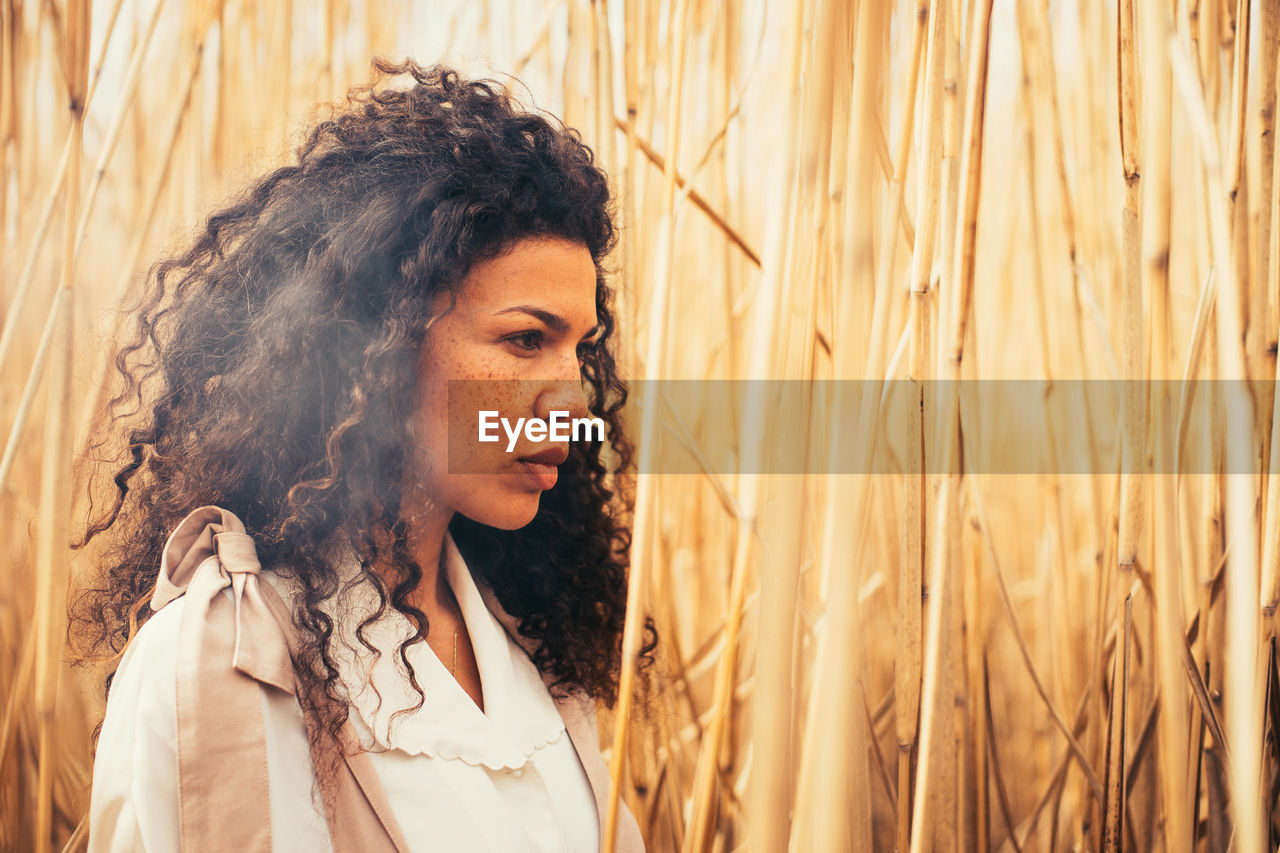 Portrait of woman standing in farm