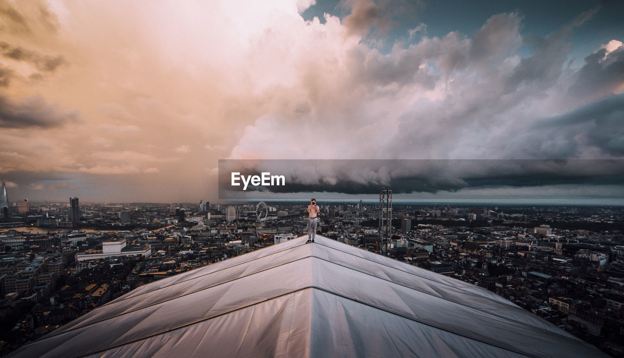 Panoramic view of illuminated city against sky at night