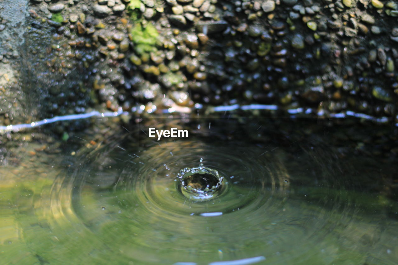 HIGH ANGLE VIEW OF WATER DROP