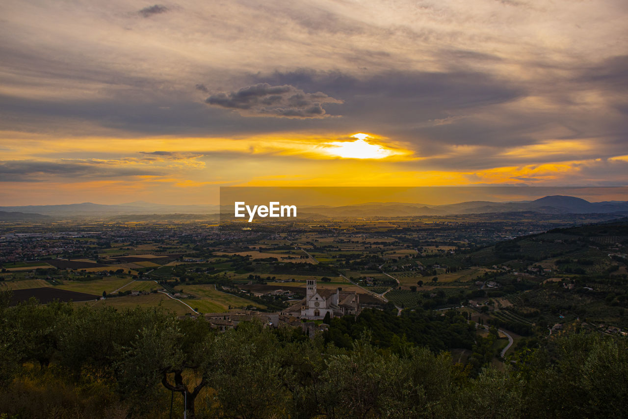 Scenic view of landscape against sky during sunset