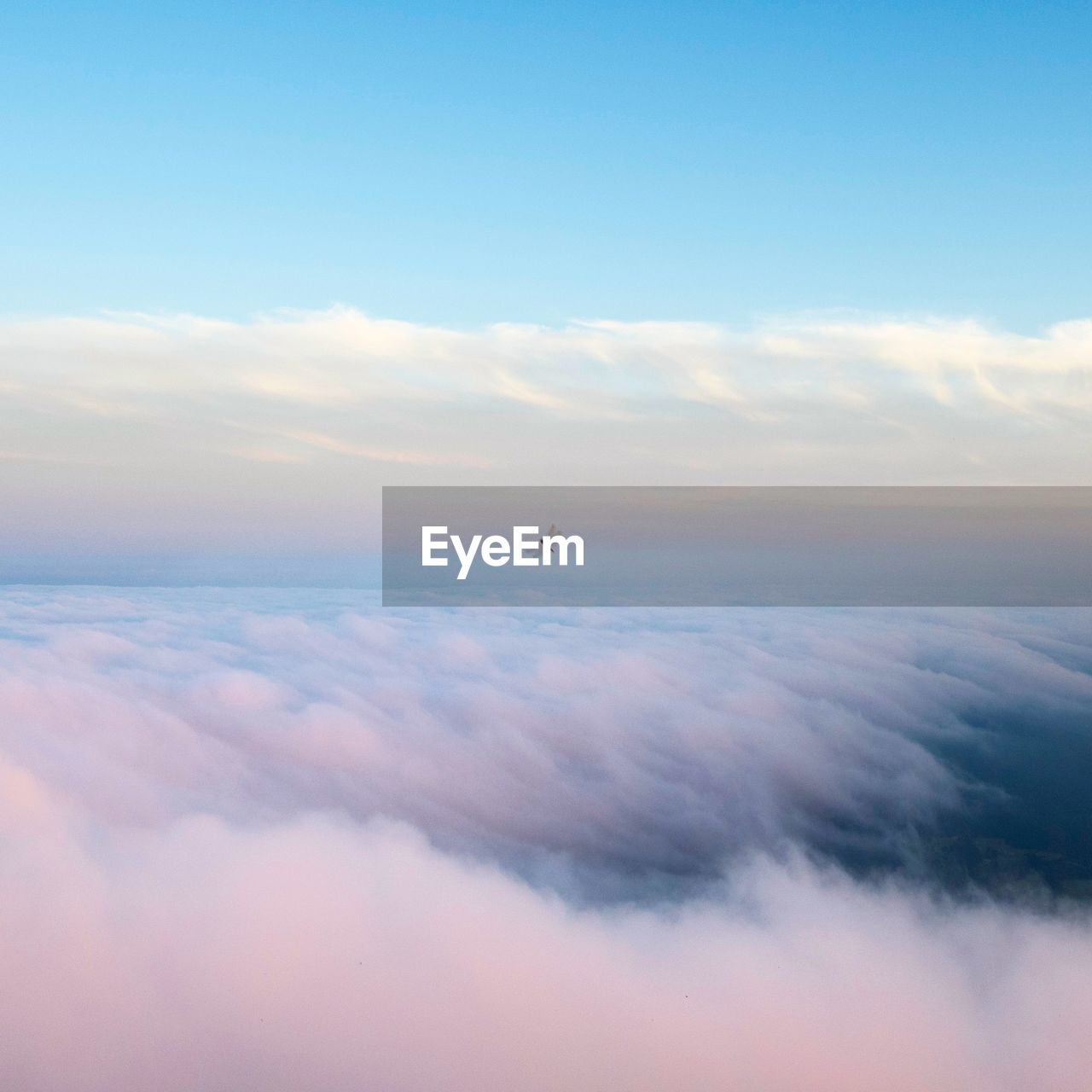 AERIAL VIEW OF CLOUDS OVER BLUE SKY