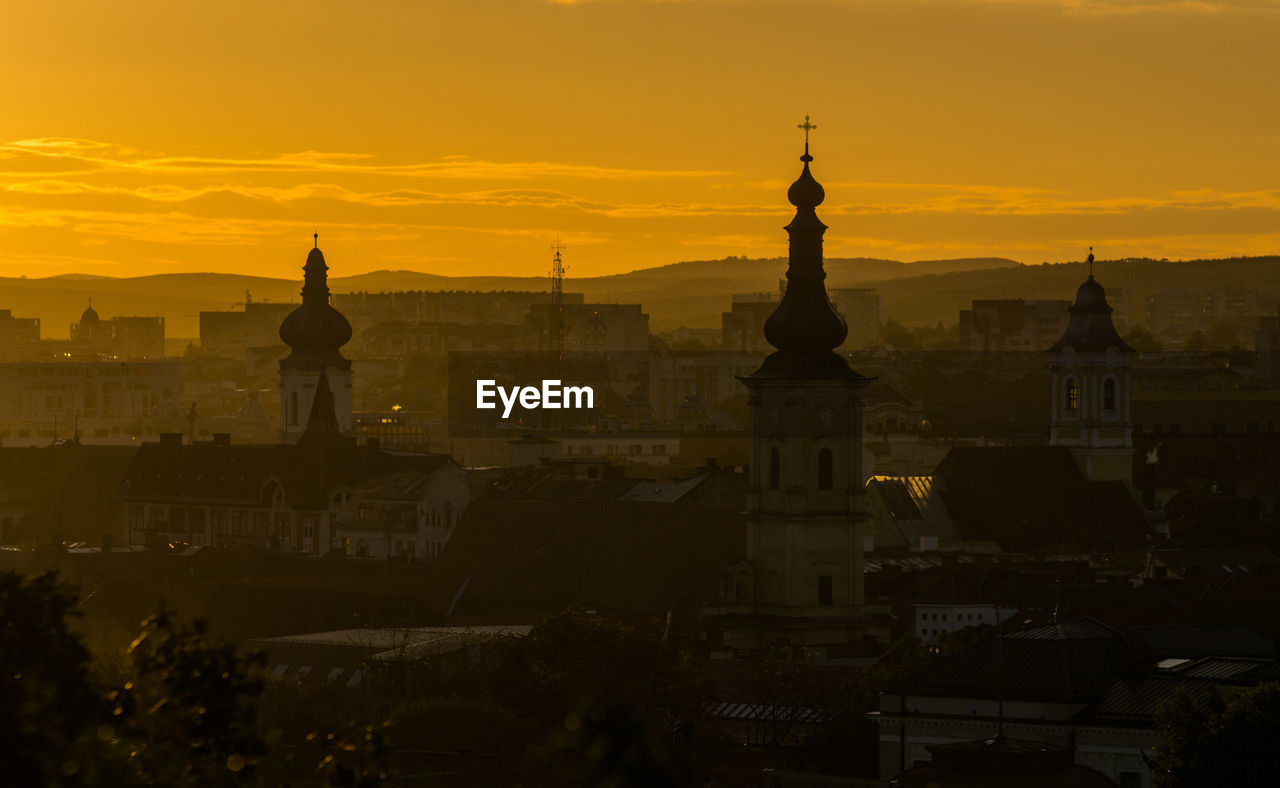 Cityscape of cluj-napoca city in the morning golden light.