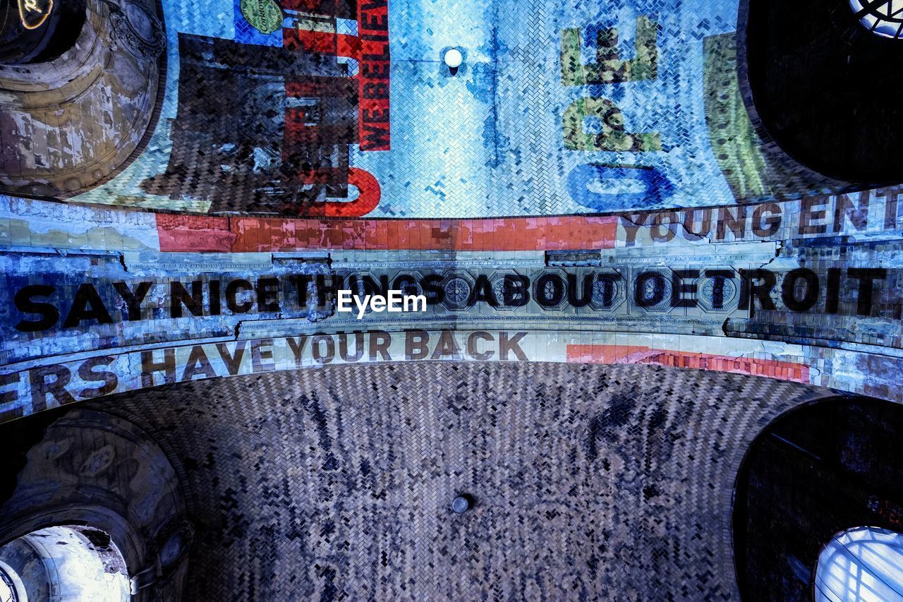 CLOSE-UP OF ABANDONED CAR WITH TEXT
