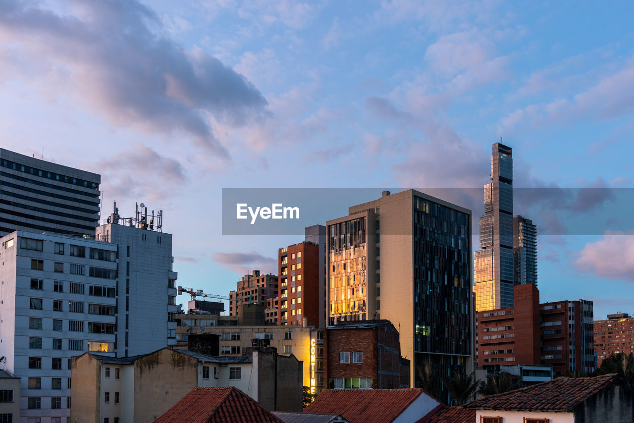 Low angle view of modern buildings against sky