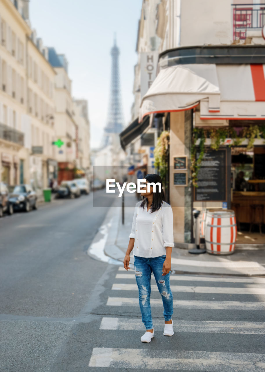 rear view of woman walking on street