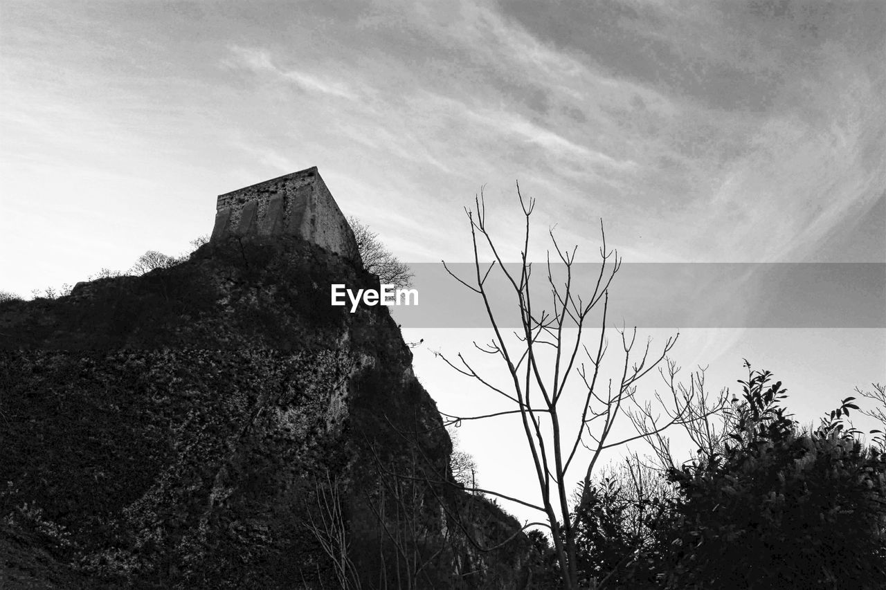 Low angle view of hill against sky