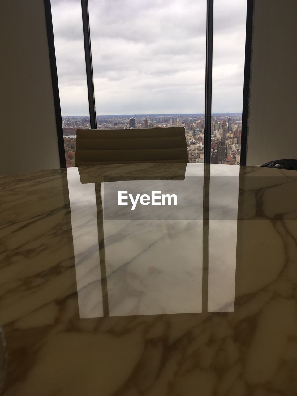 CLOSE-UP OF SEA AGAINST SKY SEEN THROUGH OPEN WINDOW