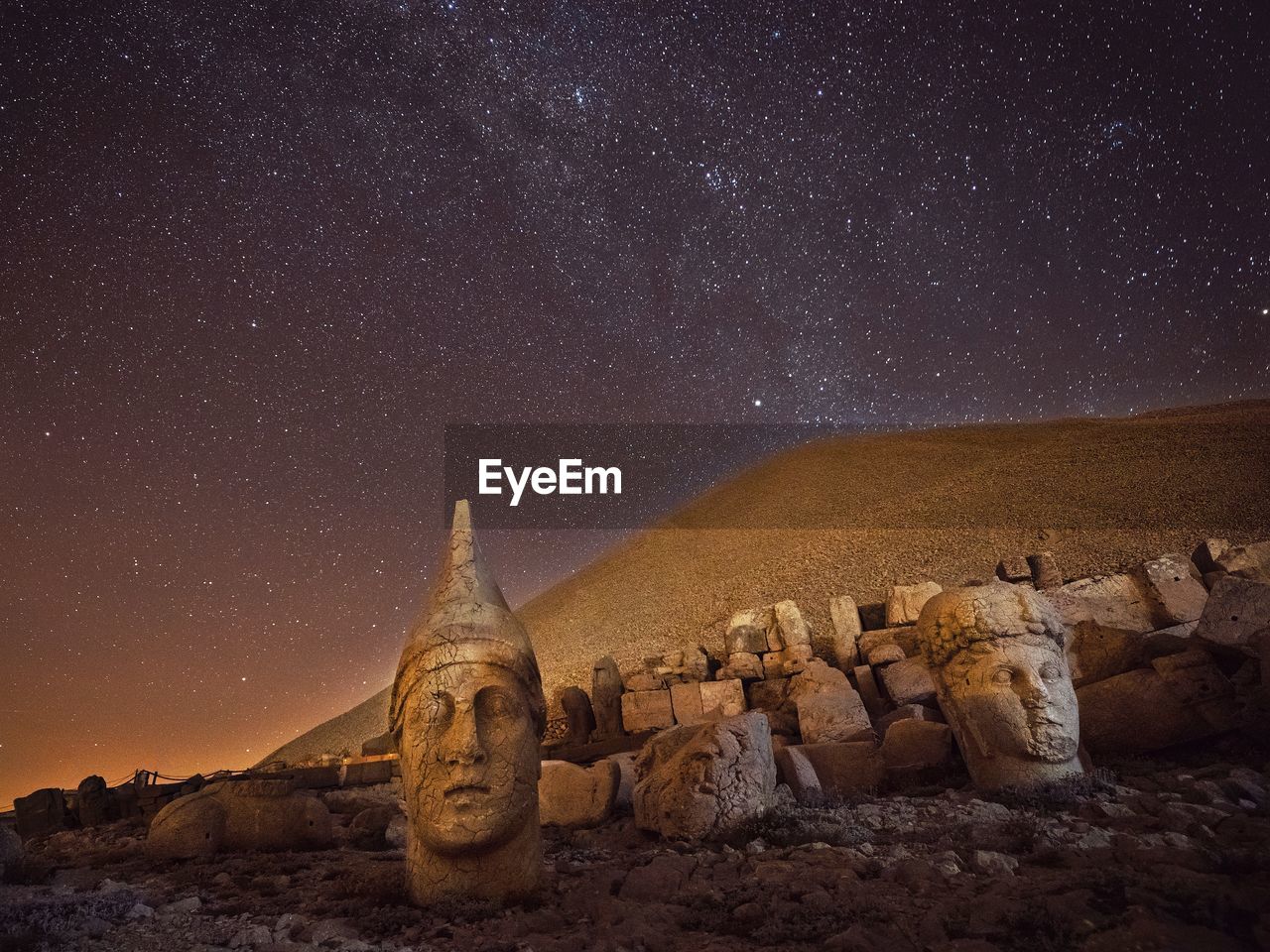 Old ruins on land at night