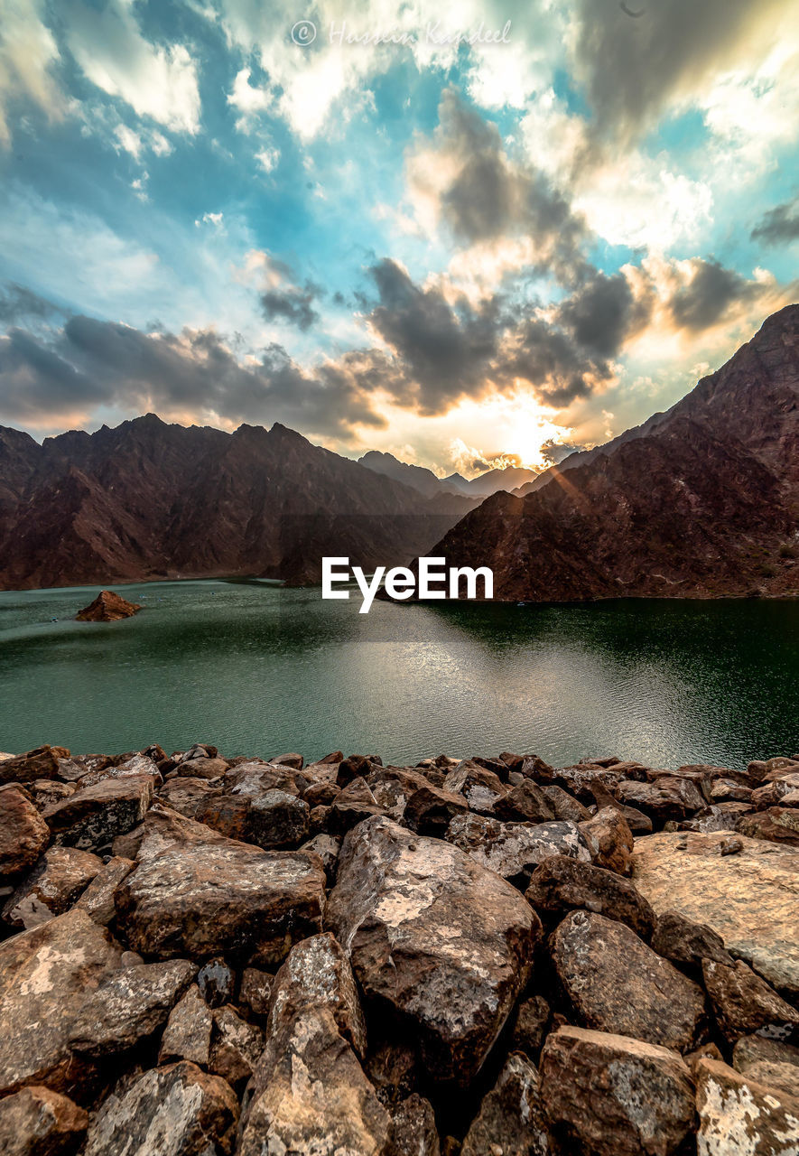 Scenic view of lake against sky during sunset