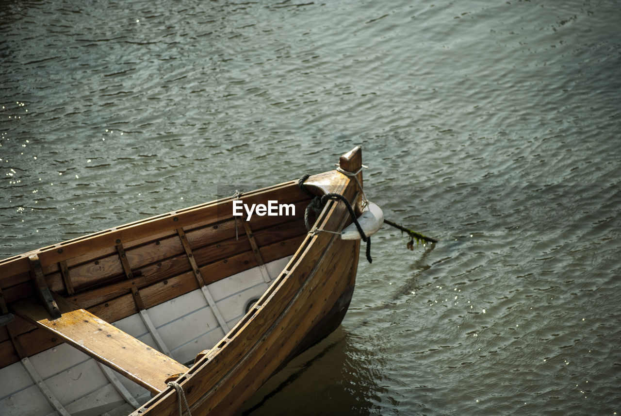 HIGH ANGLE VIEW OF NAUTICAL VESSEL ON WATER