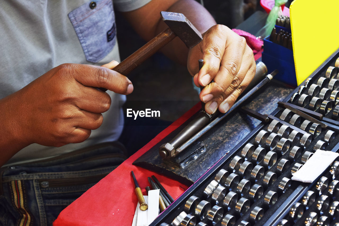 CLOSE-UP OF MAN HAND WITH TEXT