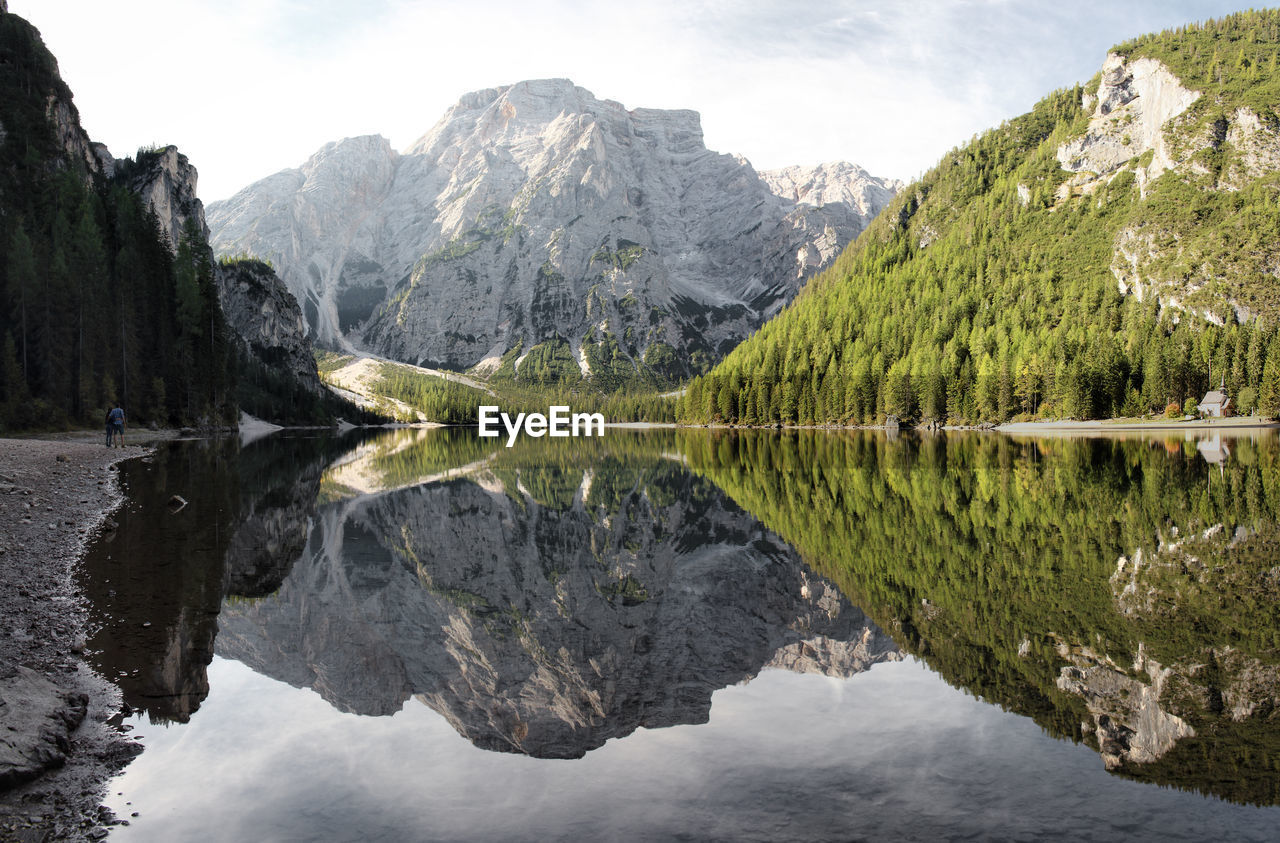 Scenic view of mountains by lake