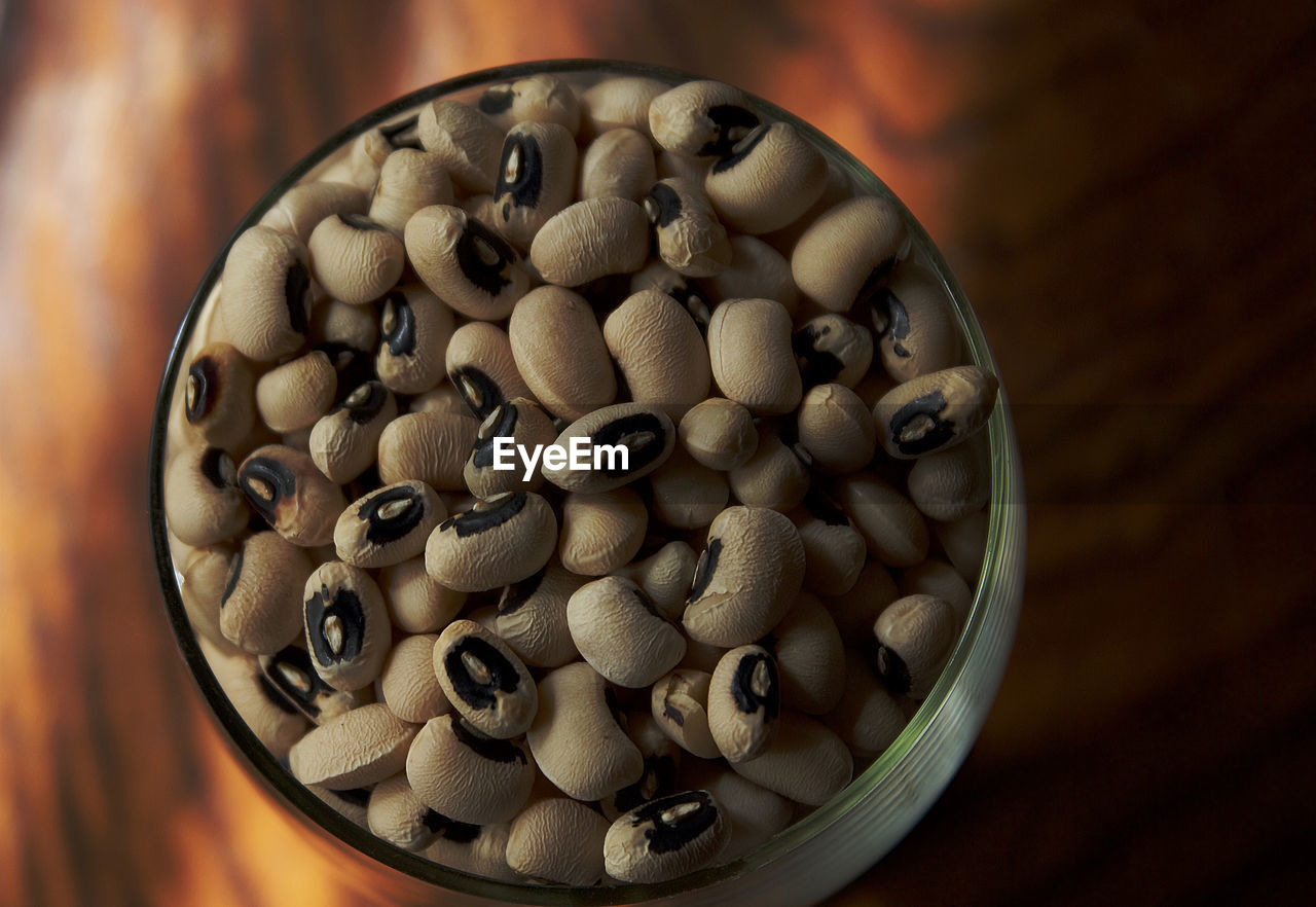 High angle view of black-eyed peas in glass bowl on table