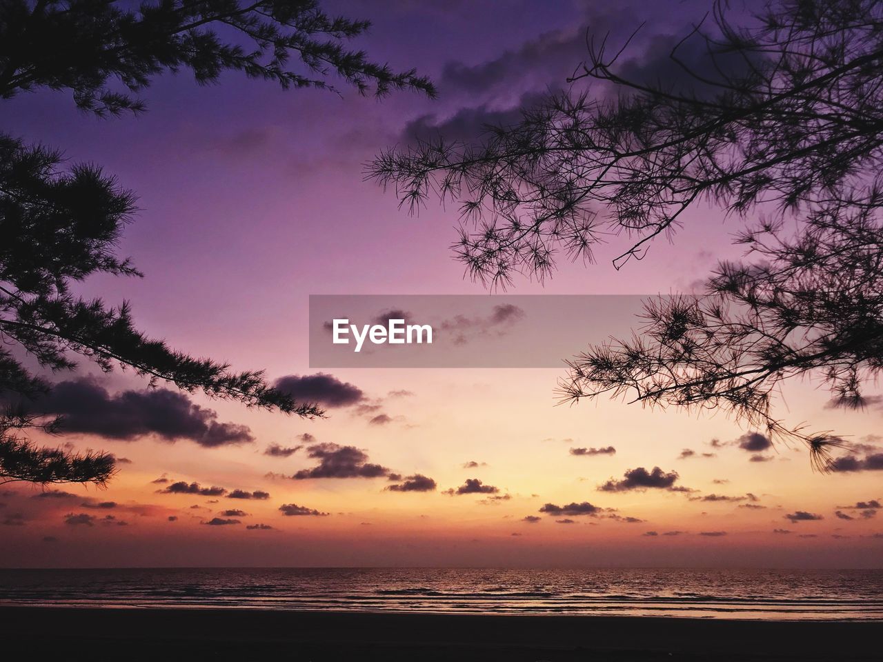 Scenic view of sea against sky at sunset