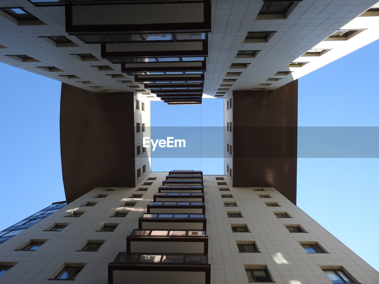 Low angle view of buildings against blue sky