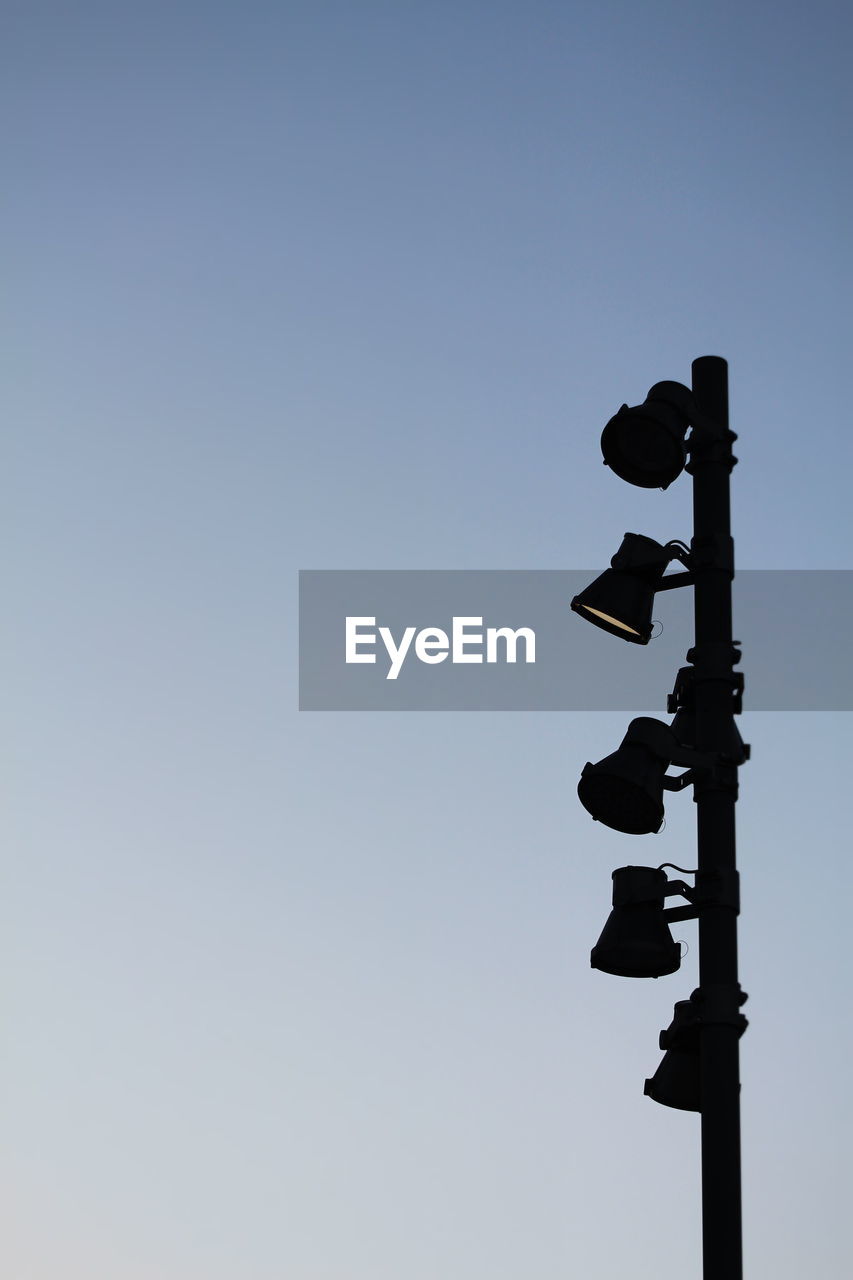 Low angle view of lamp post against clear sky