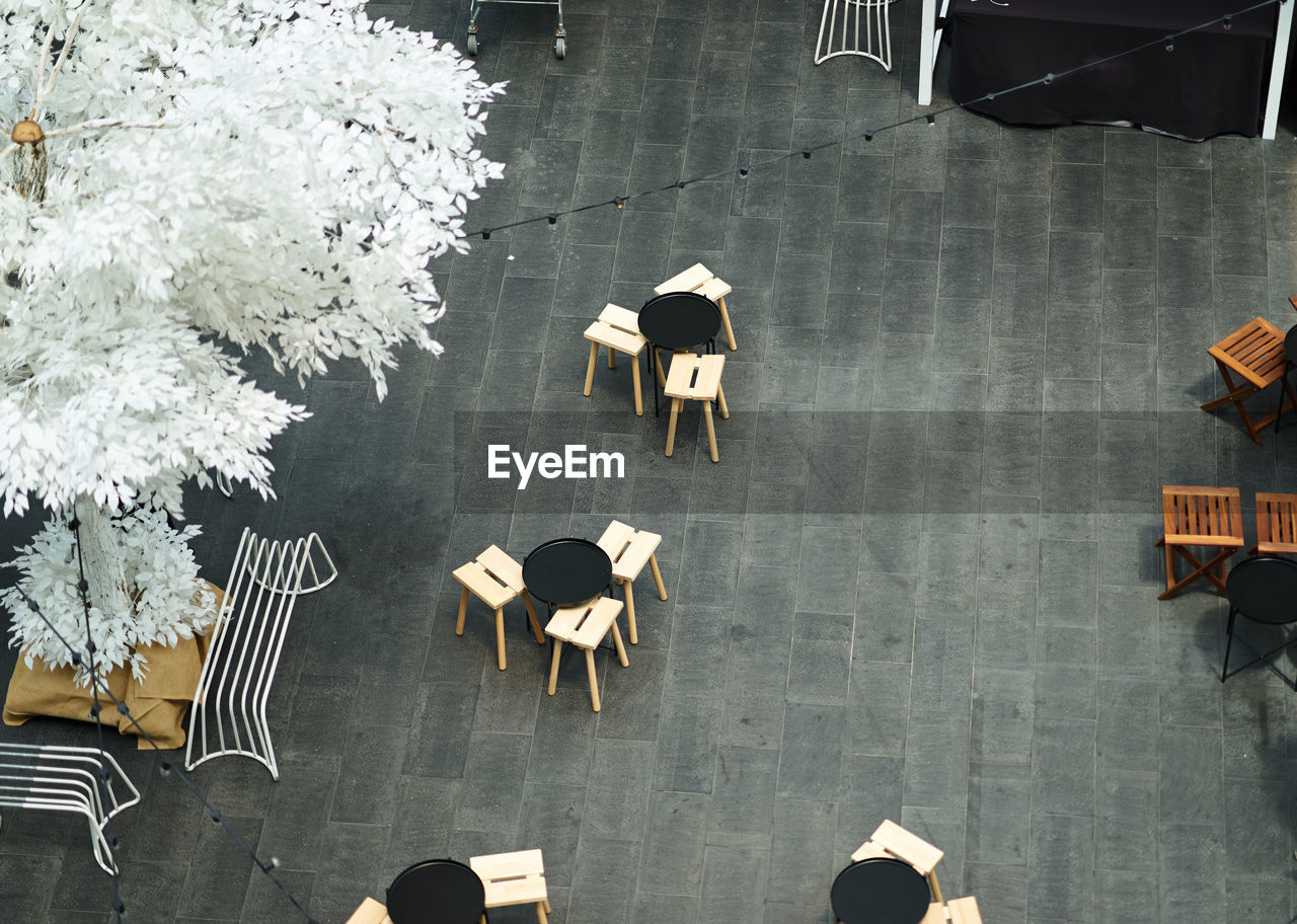 High angle view of tables and chairs in restaurant