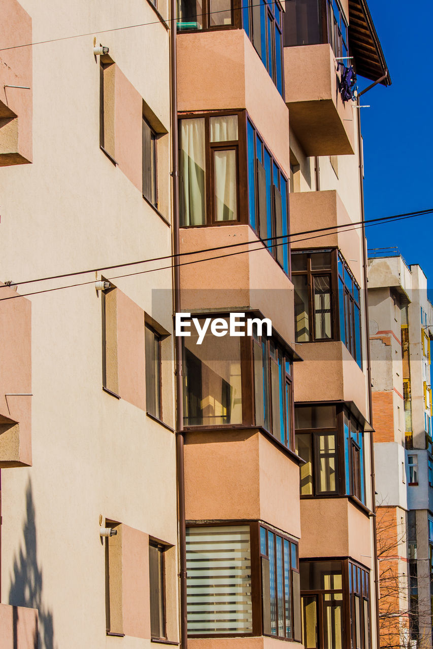 New apartment building with balcony and reflection window