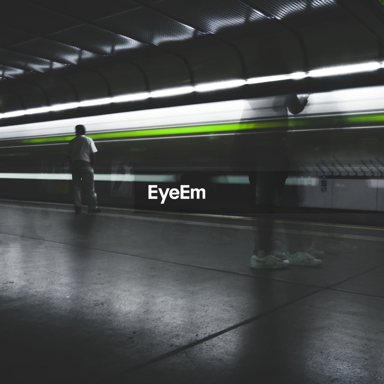 Man waiting at railroad station