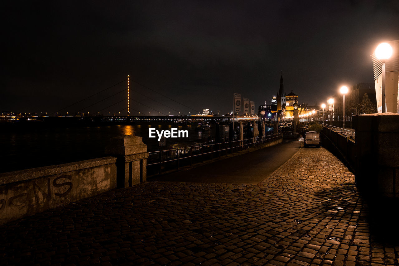 ILLUMINATED BRIDGE AT NIGHT