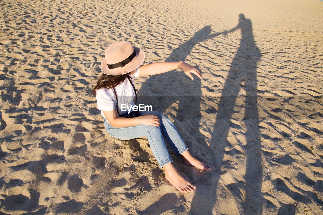 HIGH ANGLE VIEW OF WOMEN ON BEACH