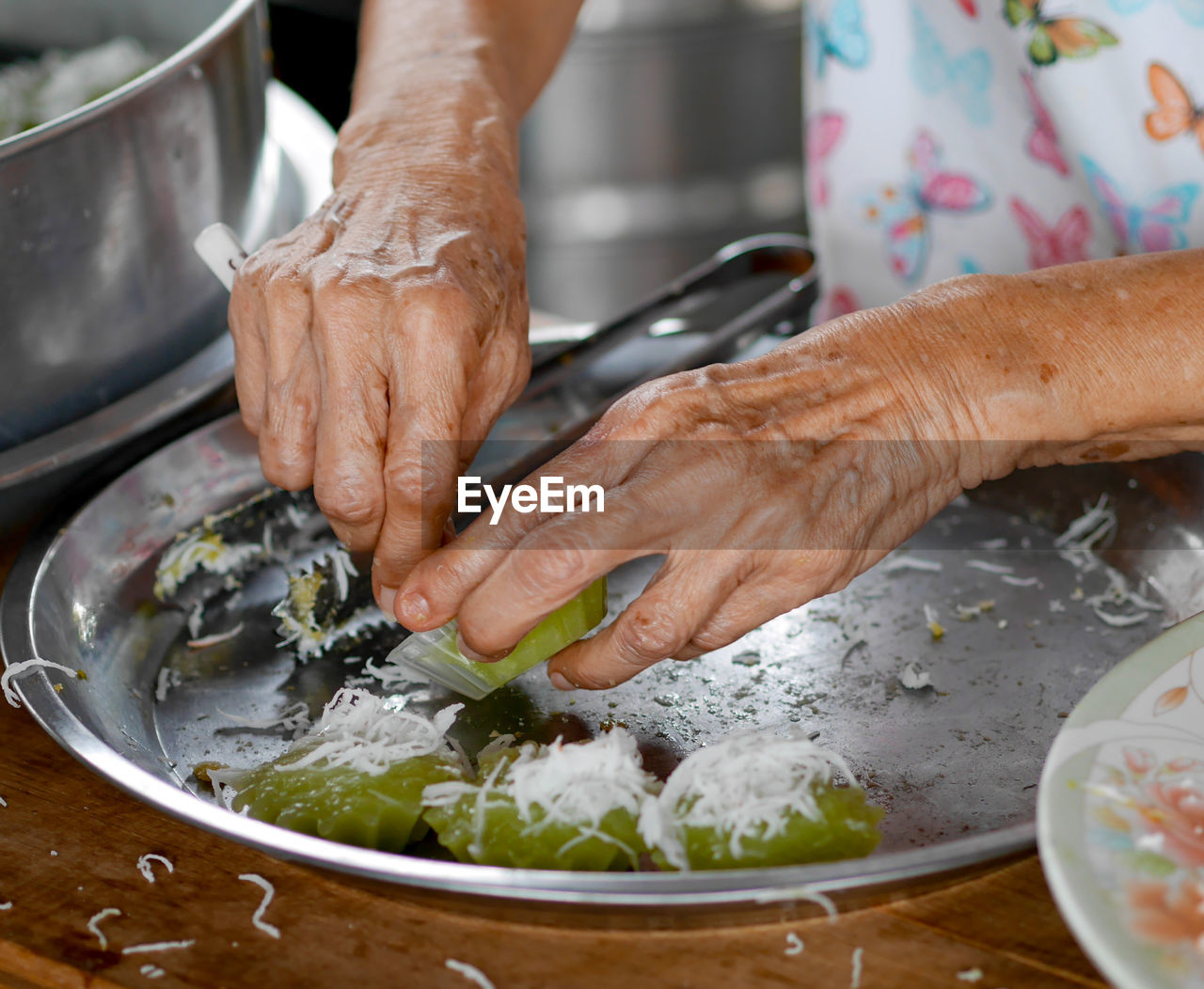 Close-up of person preparing food in kitchen