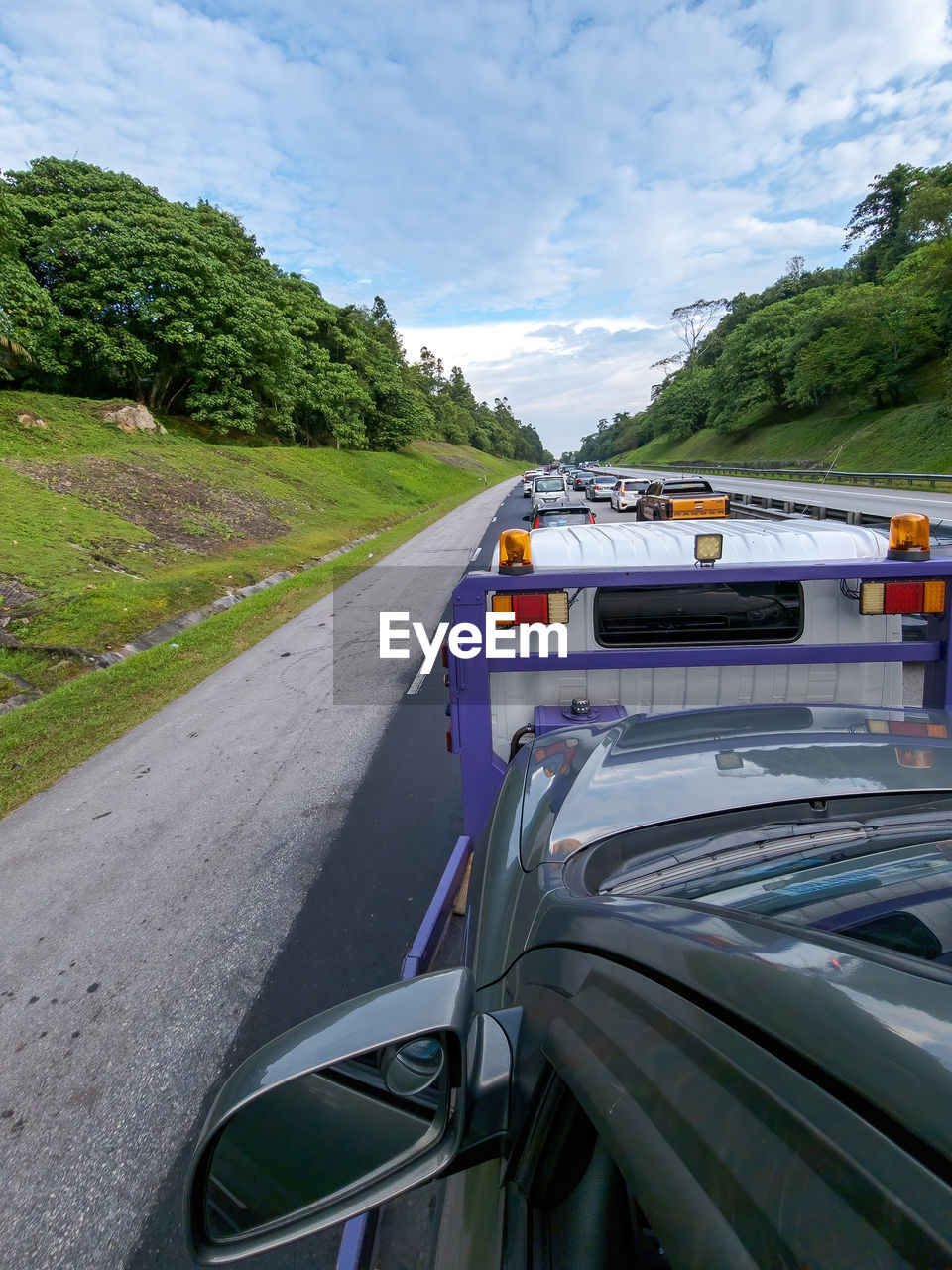 transportation, mode of transportation, motor vehicle, car, road, sky, driving, nature, cloud, travel, land vehicle, plant, landscape, environment, land, transport, vehicle, tree, day, motion, highway, outdoors, mountain, water, scenics - nature, blue, on the move