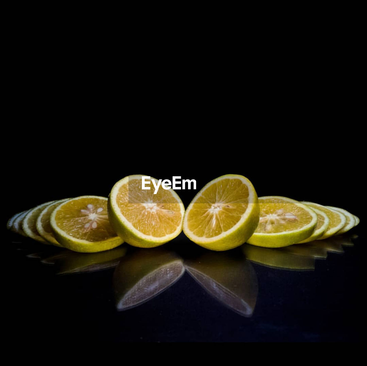 CLOSE-UP OF FRUITS AND BLACK BACKGROUND