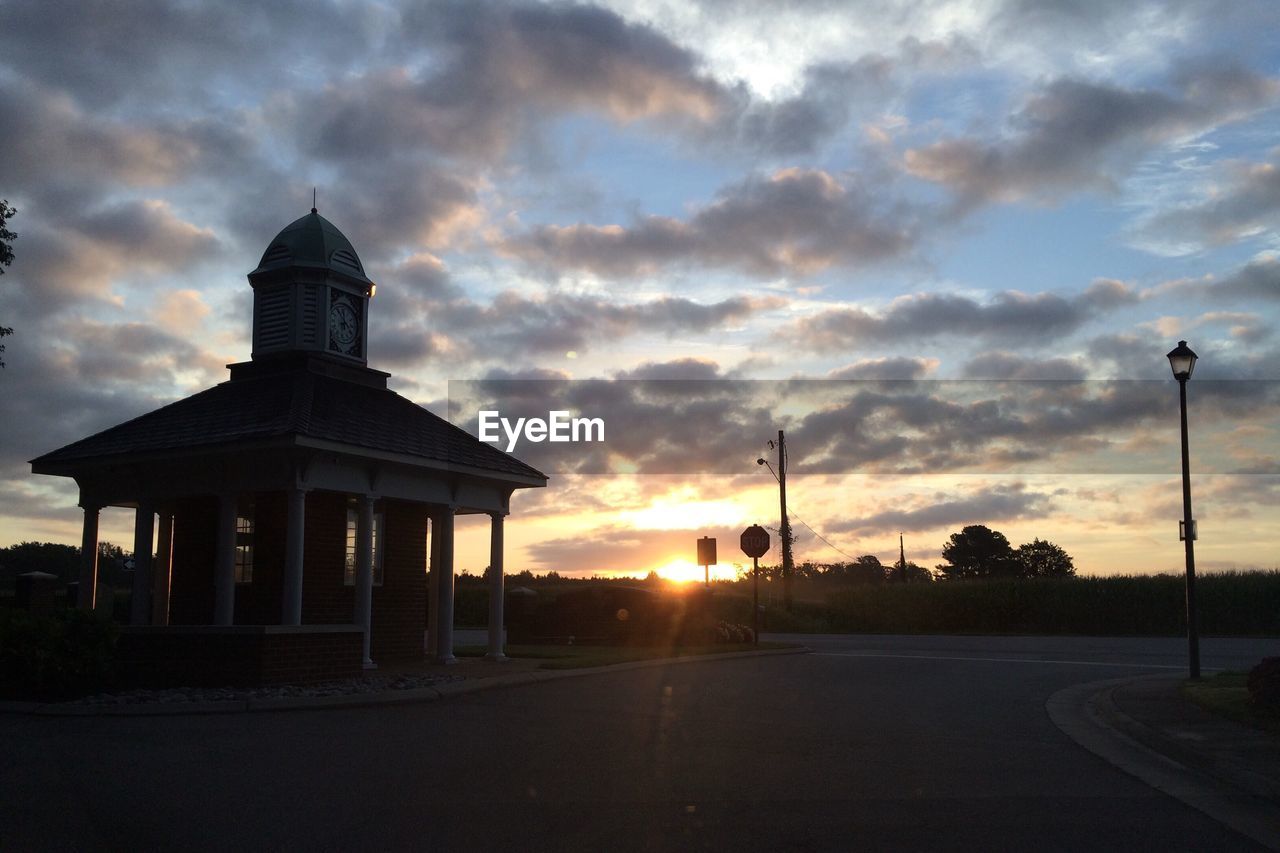 VIEW OF ROAD AGAINST CLOUDY SKY AT SUNSET