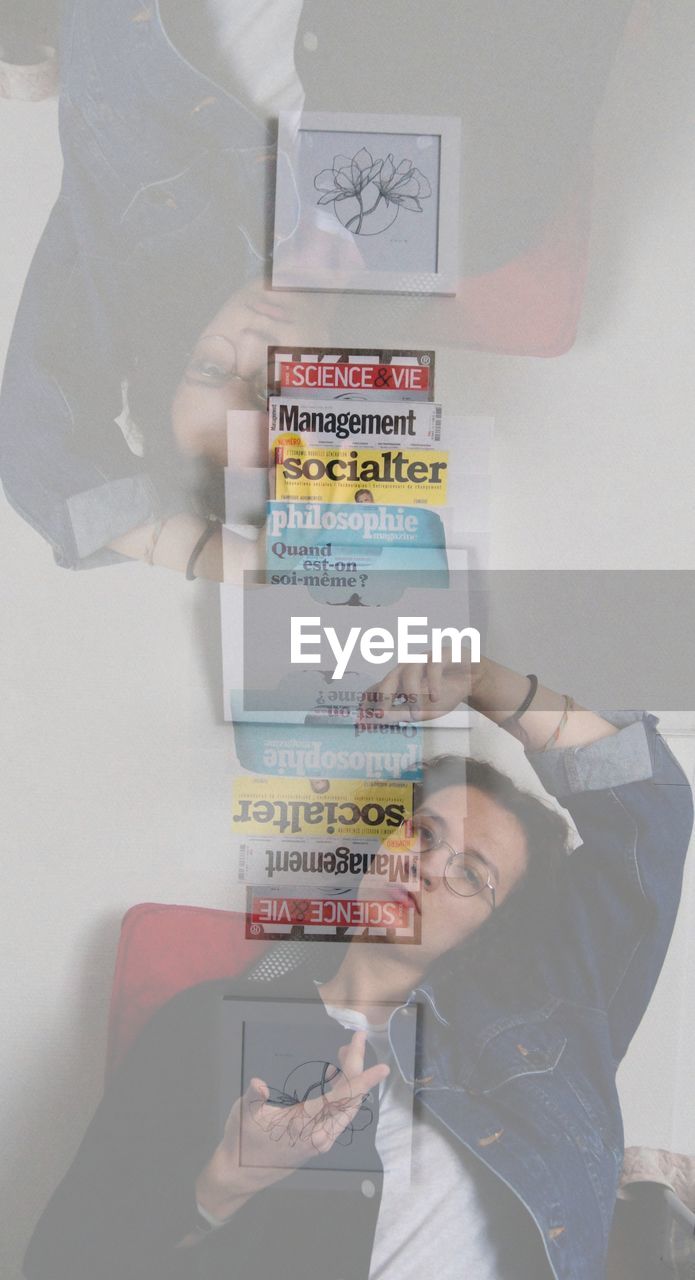 DIGITAL COMPOSITE IMAGE OF HAND HOLDING PAPER