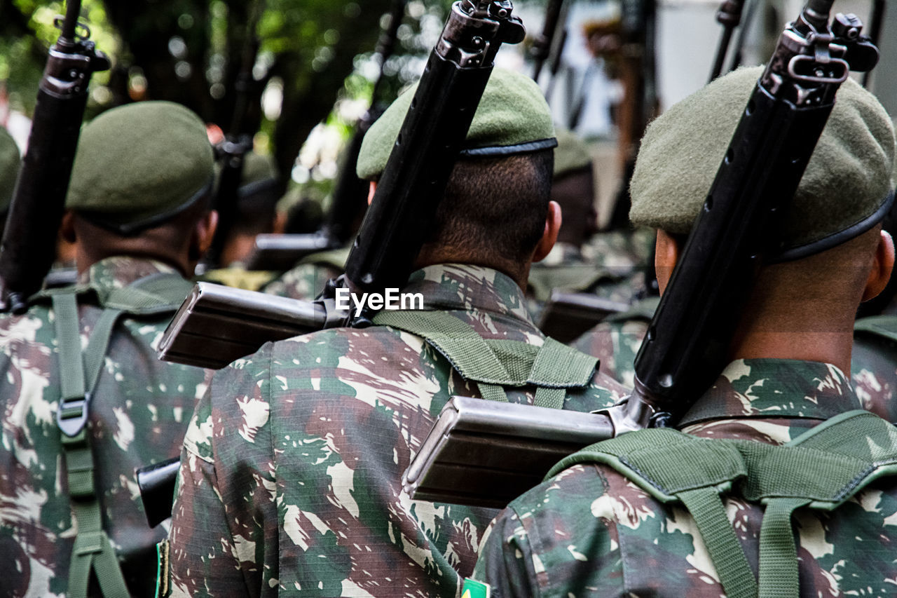 Rear view of army soldiers marching on the independence day 