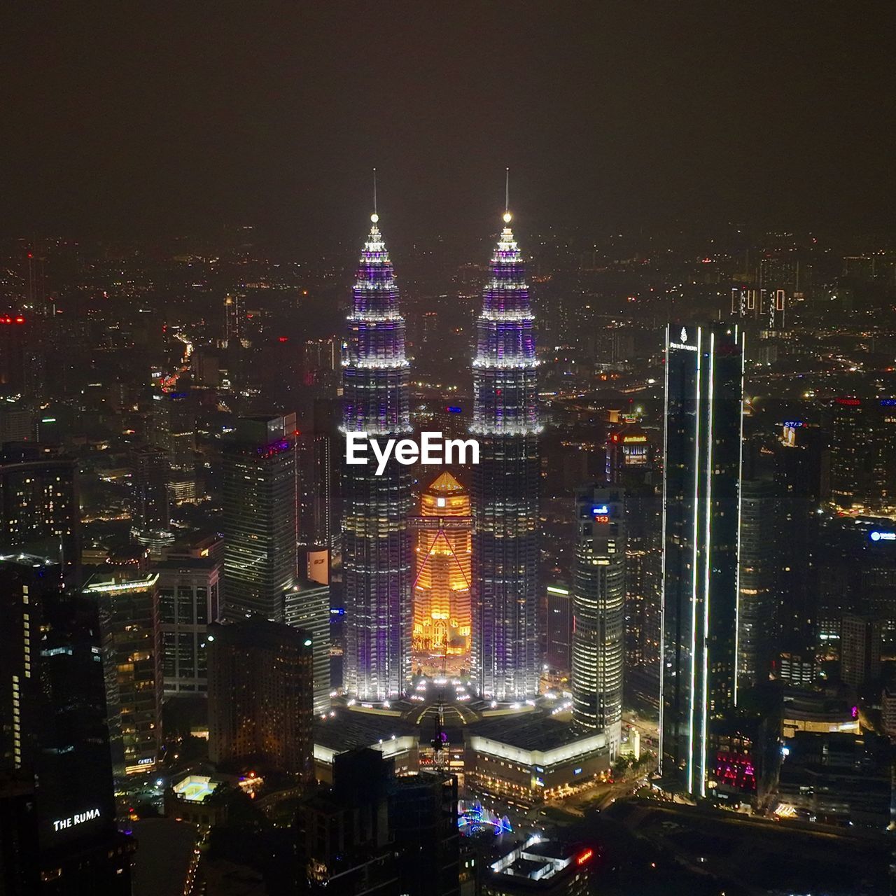 Illuminated buildings in city at night