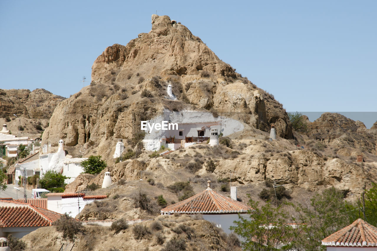 Built structure on mountain against clear sky