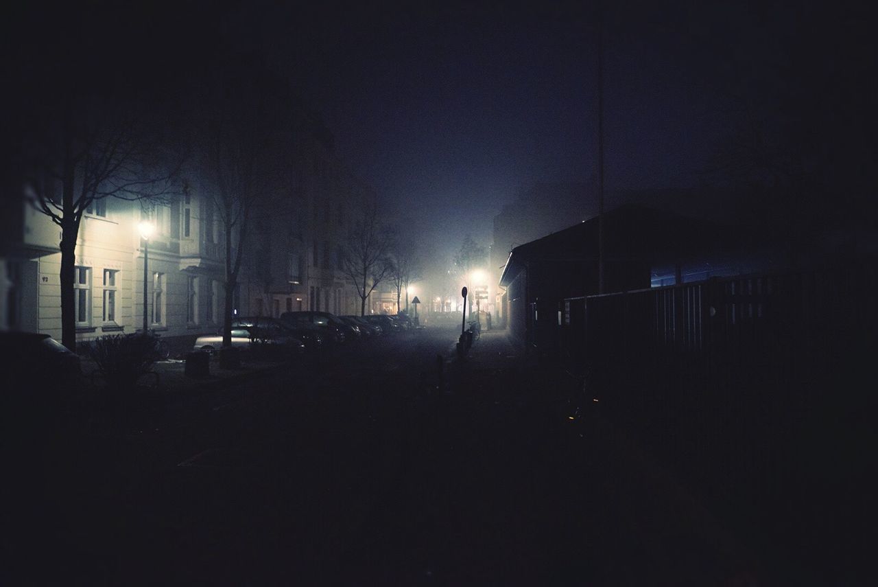 ROAD PASSING THROUGH ILLUMINATED CITY