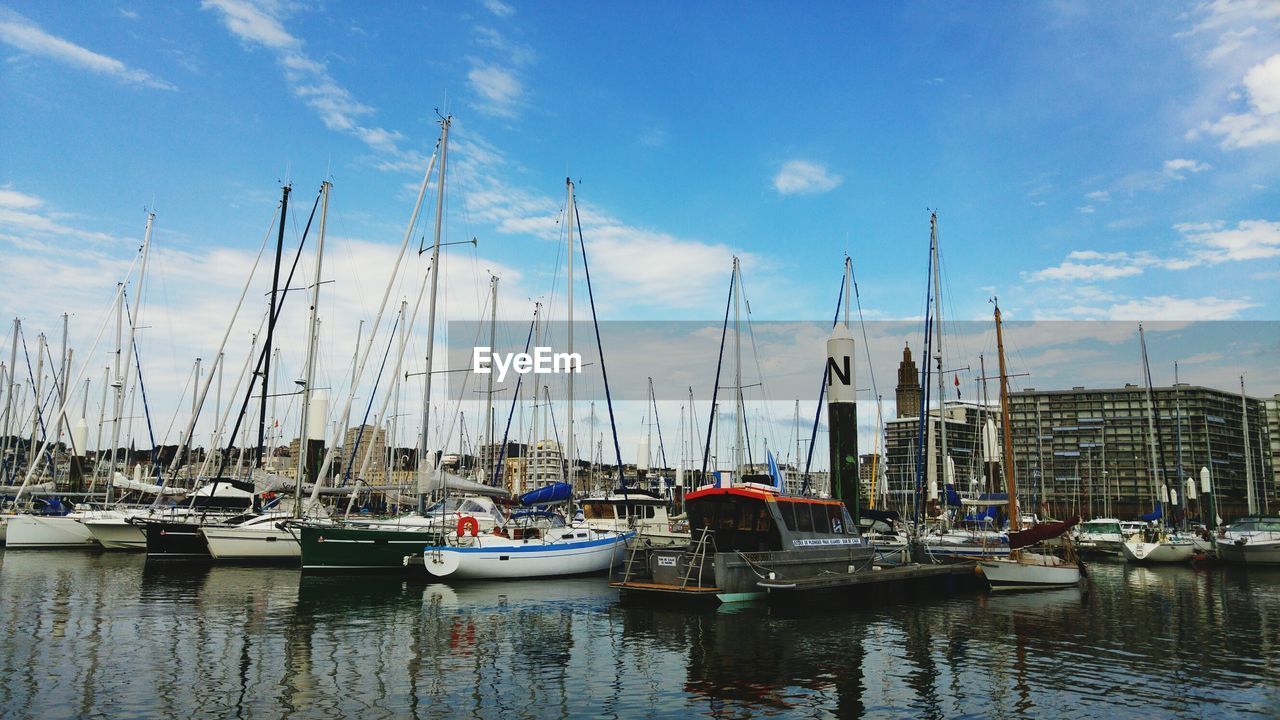 Boats moored at harbor