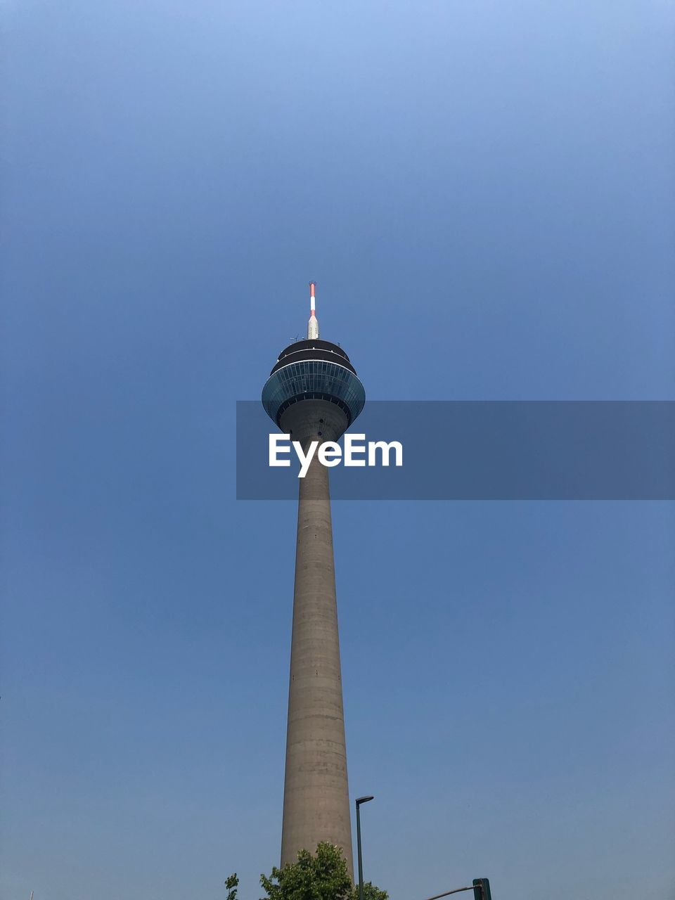 Low angle view of communications tower against sky rheinturm düsseldorf