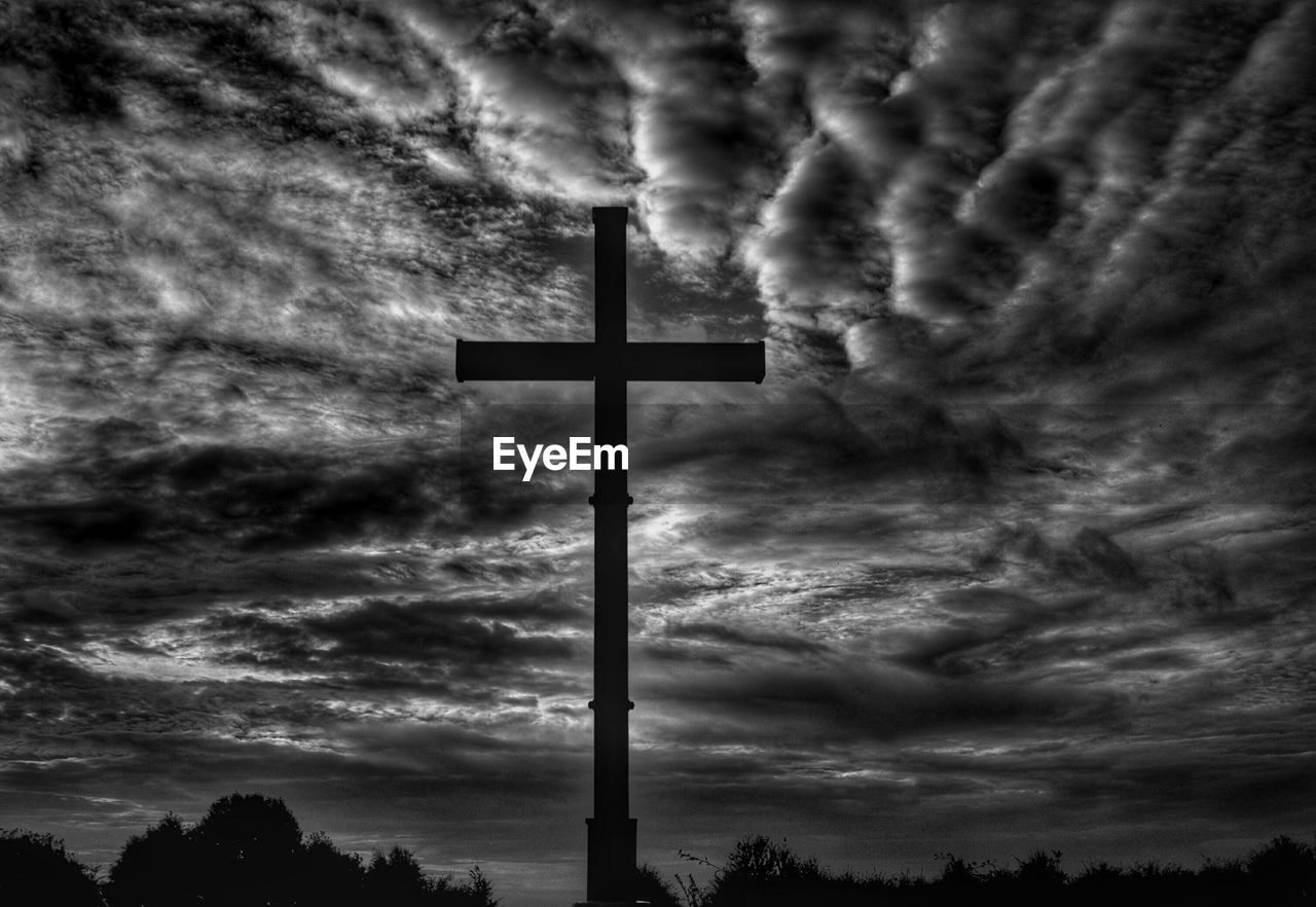 Low angle view of church against cloudy sky