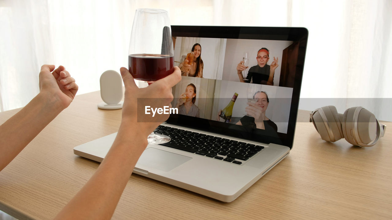 Woman talking on video chat with friends