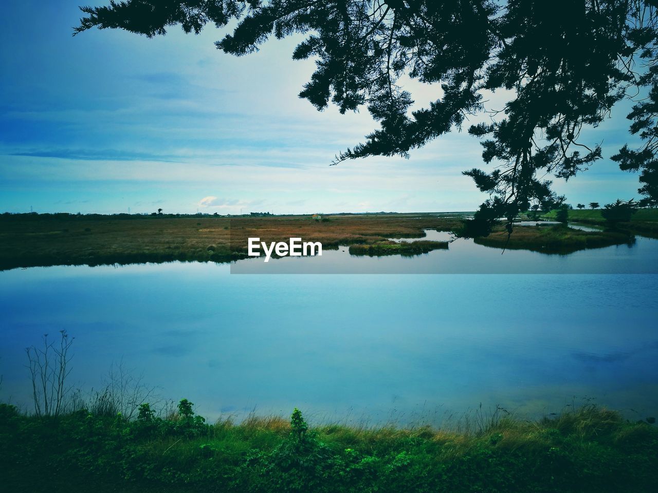 Scenic view of lake against sky