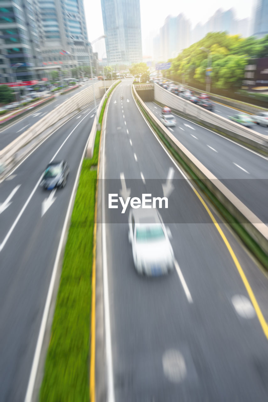 BLURRED MOTION OF CARS ON ROAD