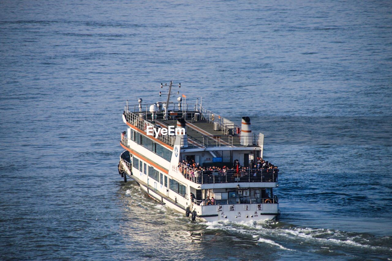 High angle view of ferry boat sailing on sea
